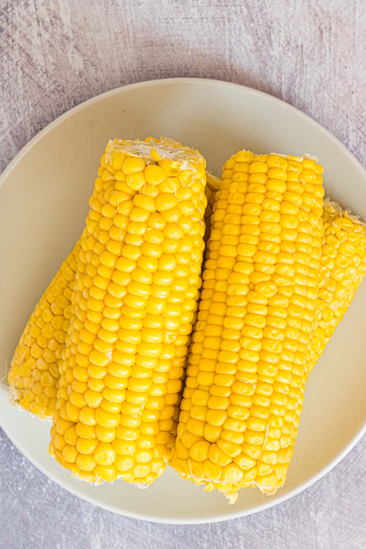 Top to bottom view of the complete recipe of how to heat corn on the cob