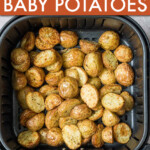 halved baby potatoes on an air fryer basket