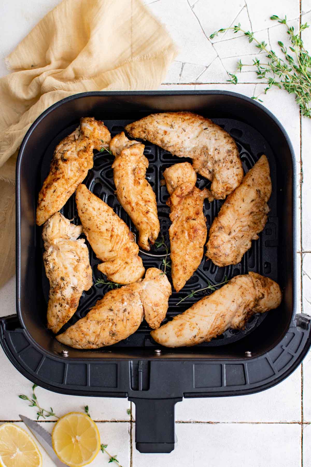 top down view of the finished chicken tenders inside the air fryer basket