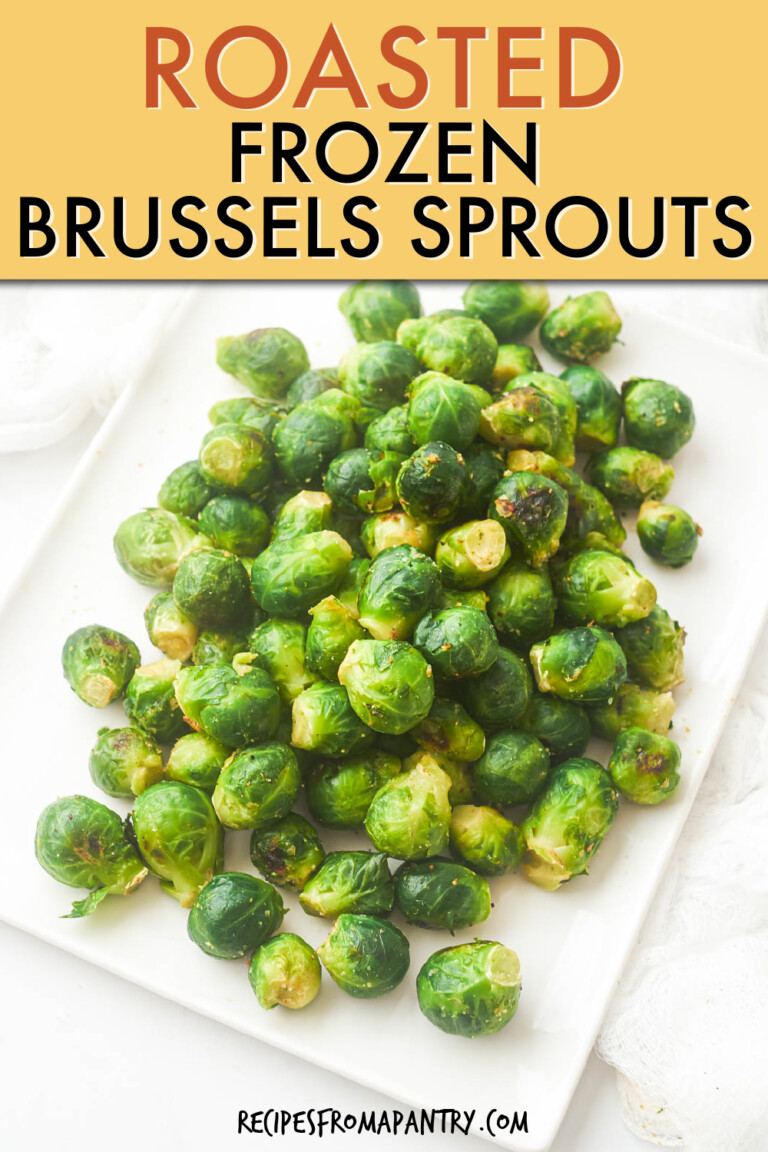 Whole roasted brussels sprouts on a rectangular dish