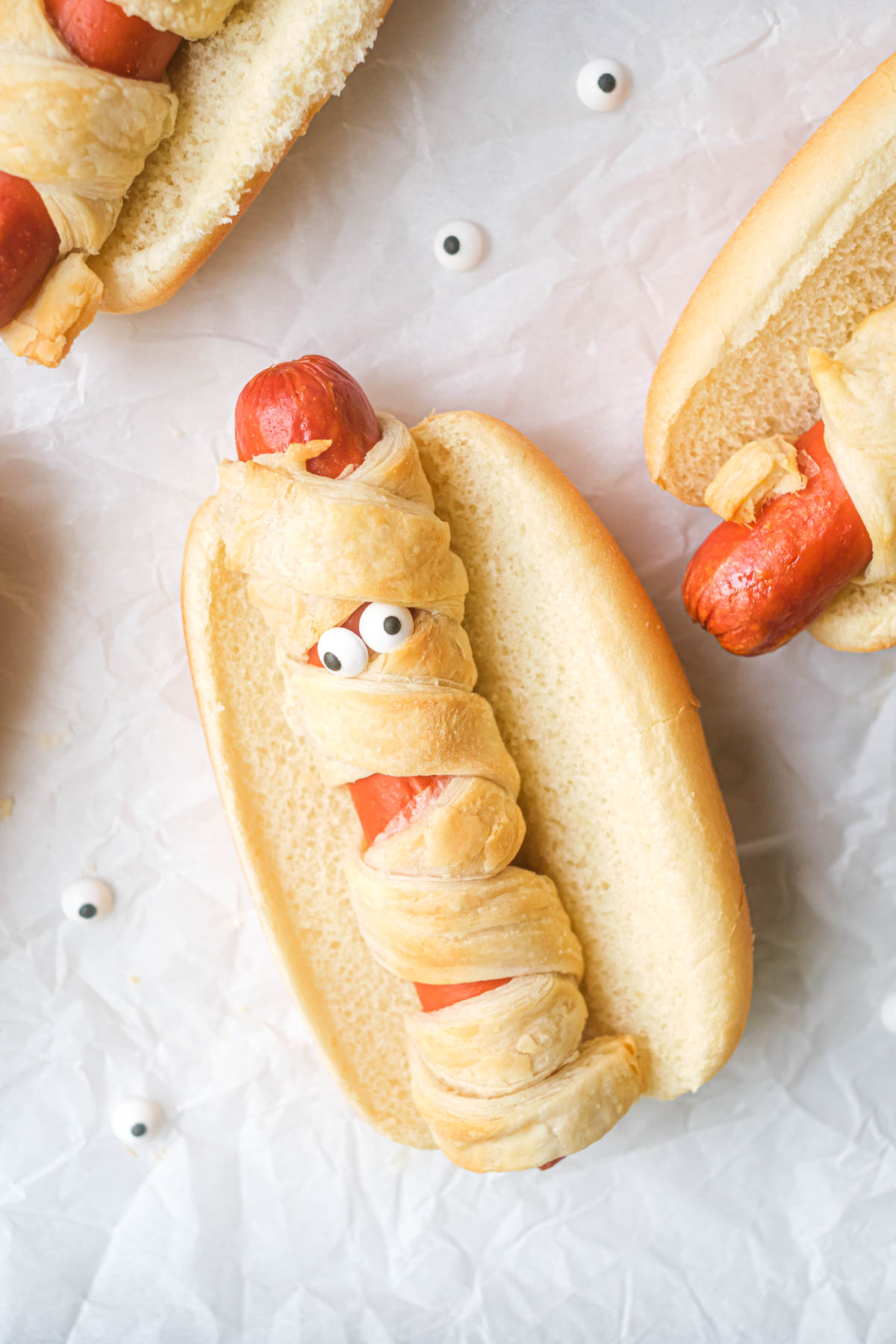 close up view of one of the mummy hot dogs from the air fryer mummy dogs recipe