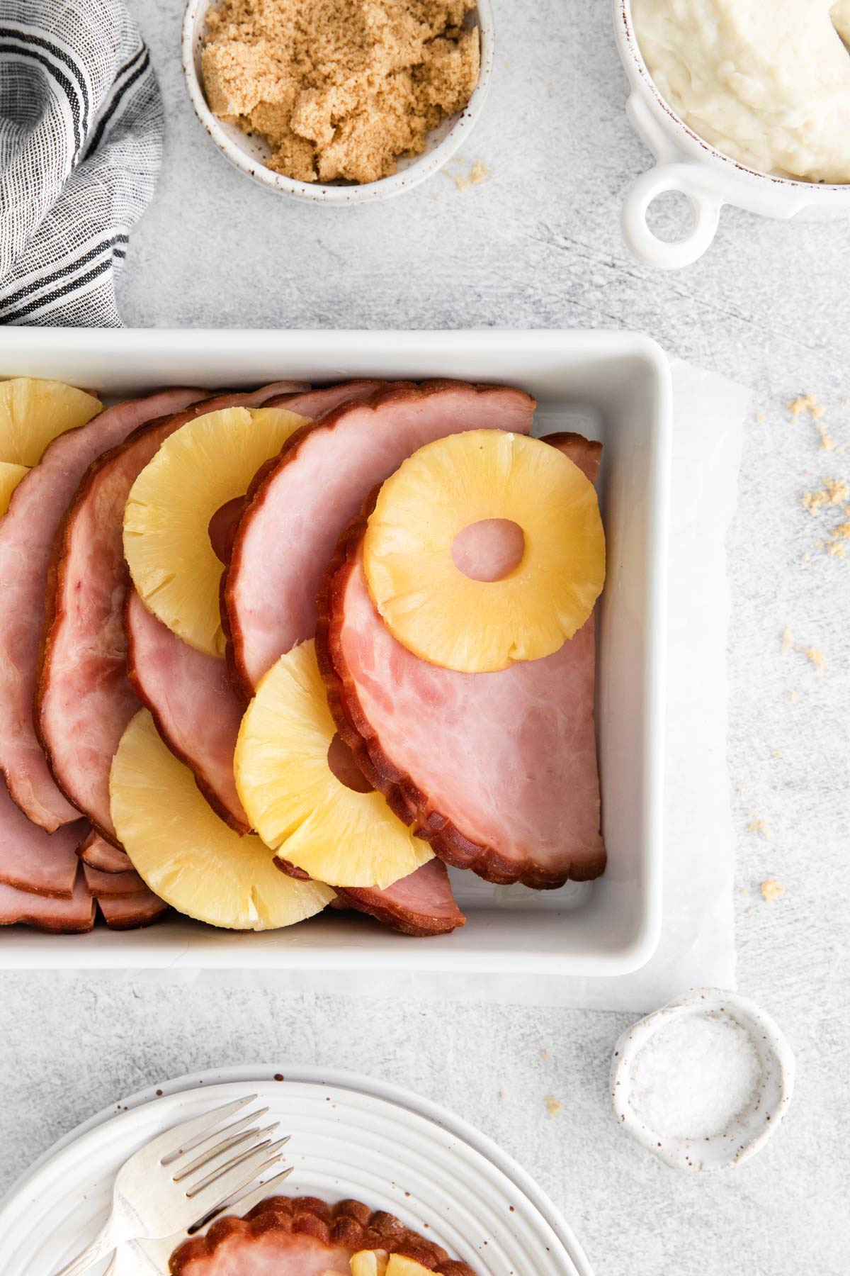 top down view of the instant pot ham and pineapple in a white serving dish