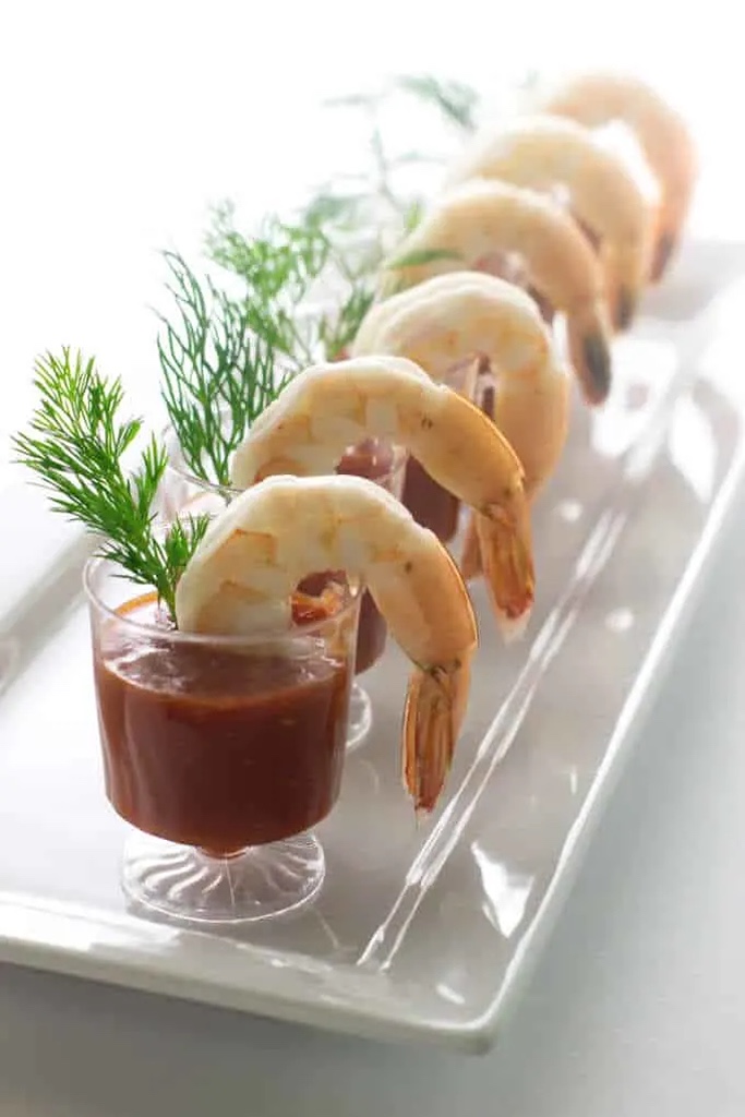 This collection of Christmas Appetizers are as festive and as fun to make as they are to eat! Easy Christmas appetizers like these are perfect for serving at Christmas dinner, bringing to potlucks, and setting out for holiday open houses and cocktail parties. And this post has all of your appetizer needs covered, from cheese and meats to vegetarian fare, there's a dish to satisfy all your guests this holiday season! Click through to get the awesome Christmas Appetizers!! #christmasrecipes #food