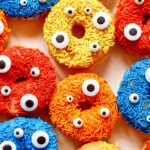 multicolored DIY Halloween Donuts with monster eyes