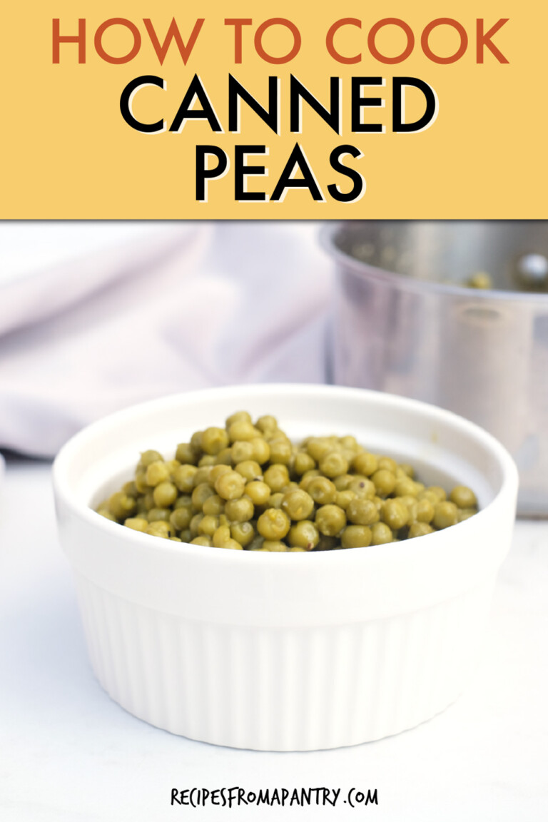 peas in a round serving dish with a cooking pot in the background.