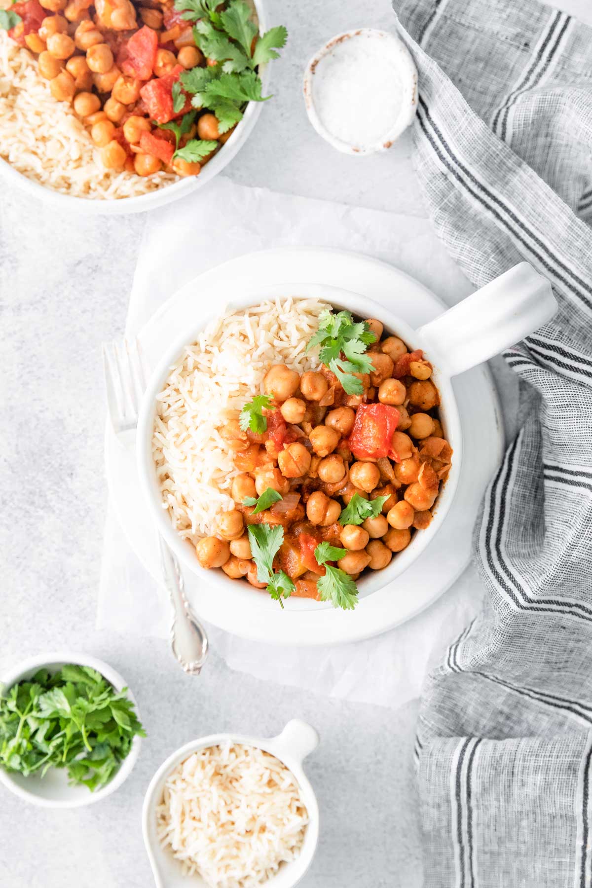 top down view of the chana masala instant pot recipe served in white mugs
