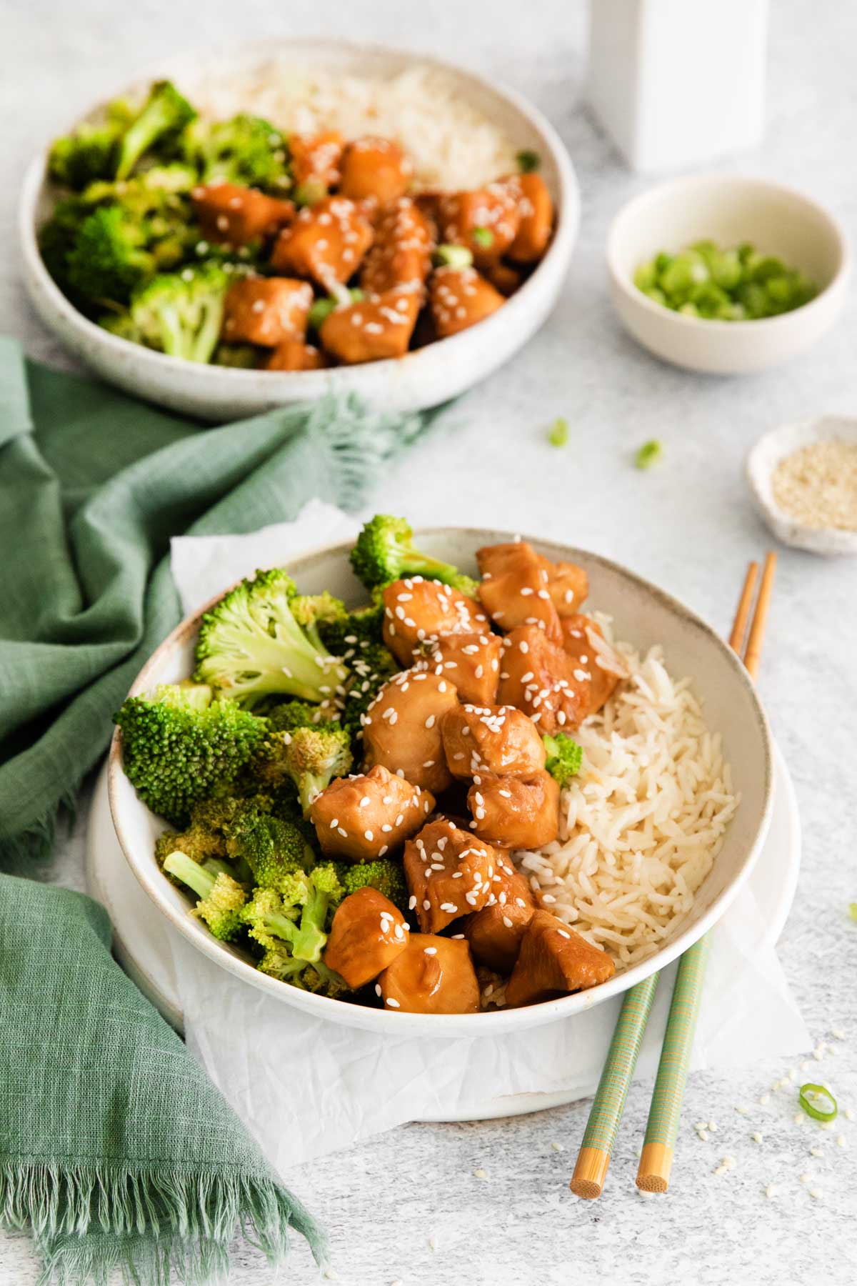 two bowls of instant pot teriyaki chicken and broccoli