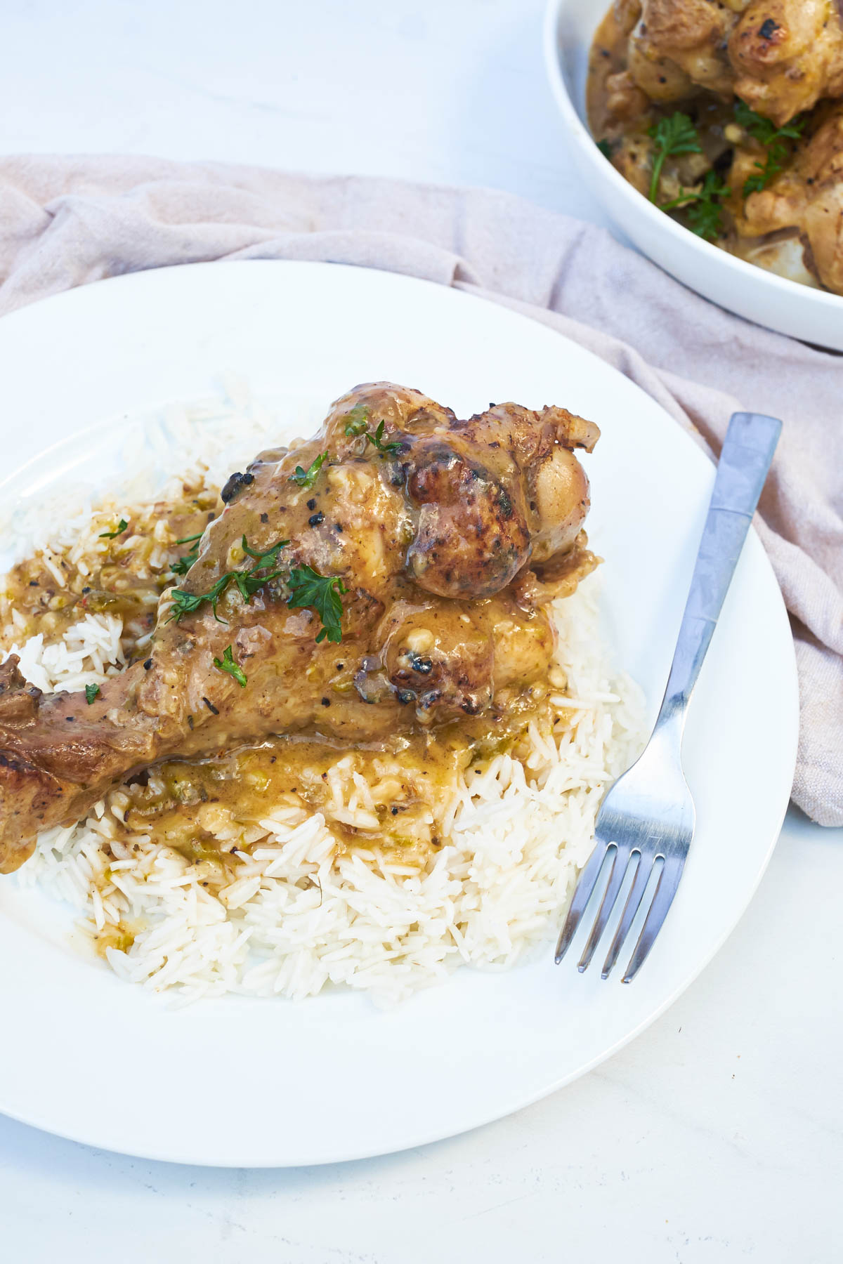 a plate of smothered turkey wings instant pot served with rice