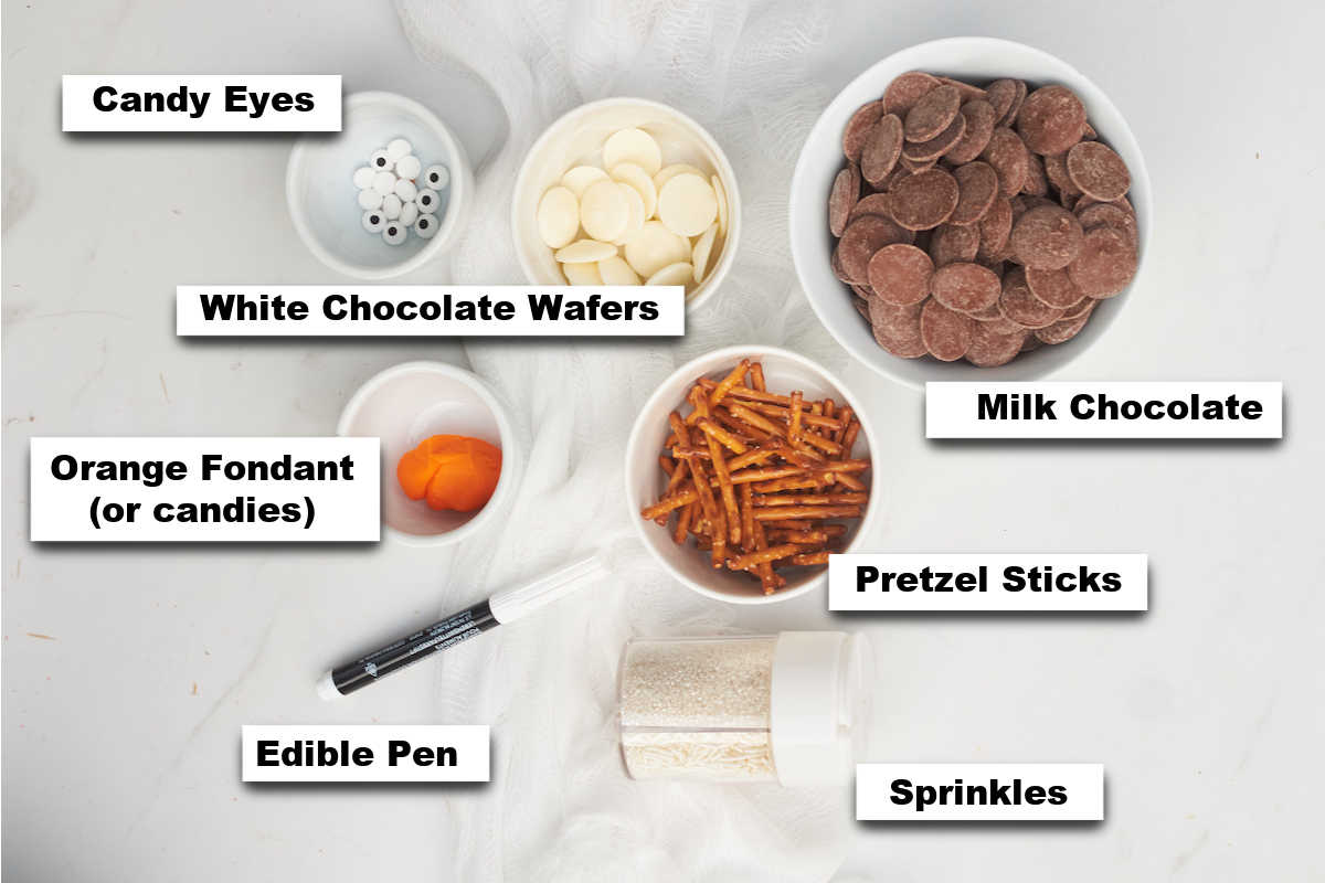 the ingredients for making melted snowman chocolate bark