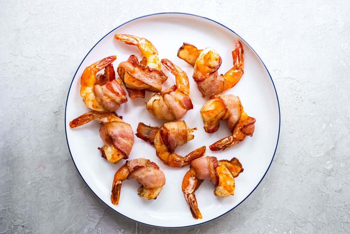 top down view of the air fryer bacon wrapped shrimp on a plate