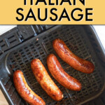 four cooked italian sausages in an air fryer basket