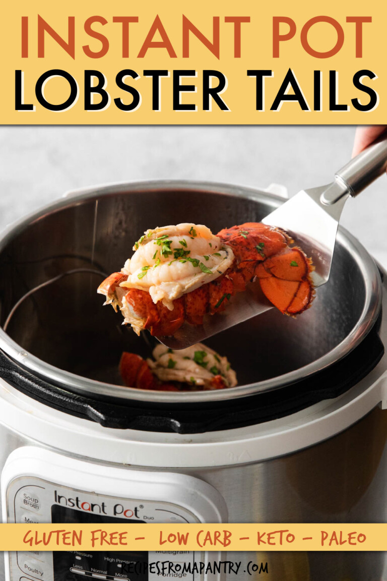 A lobster tail being lifted out of an instant pot with a metal spatula