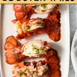 Four lobster tails on a serving tray