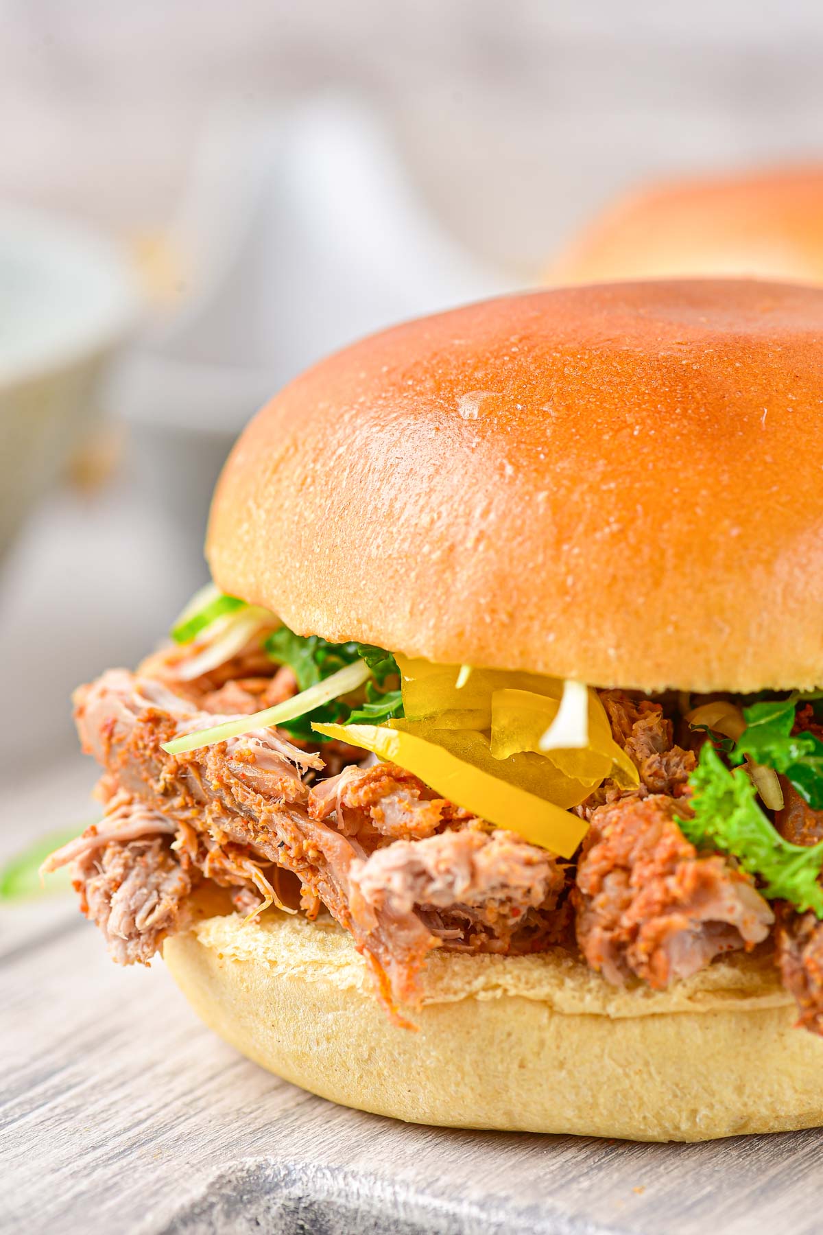 close up view of the bbq pulled pork made into a sandwich