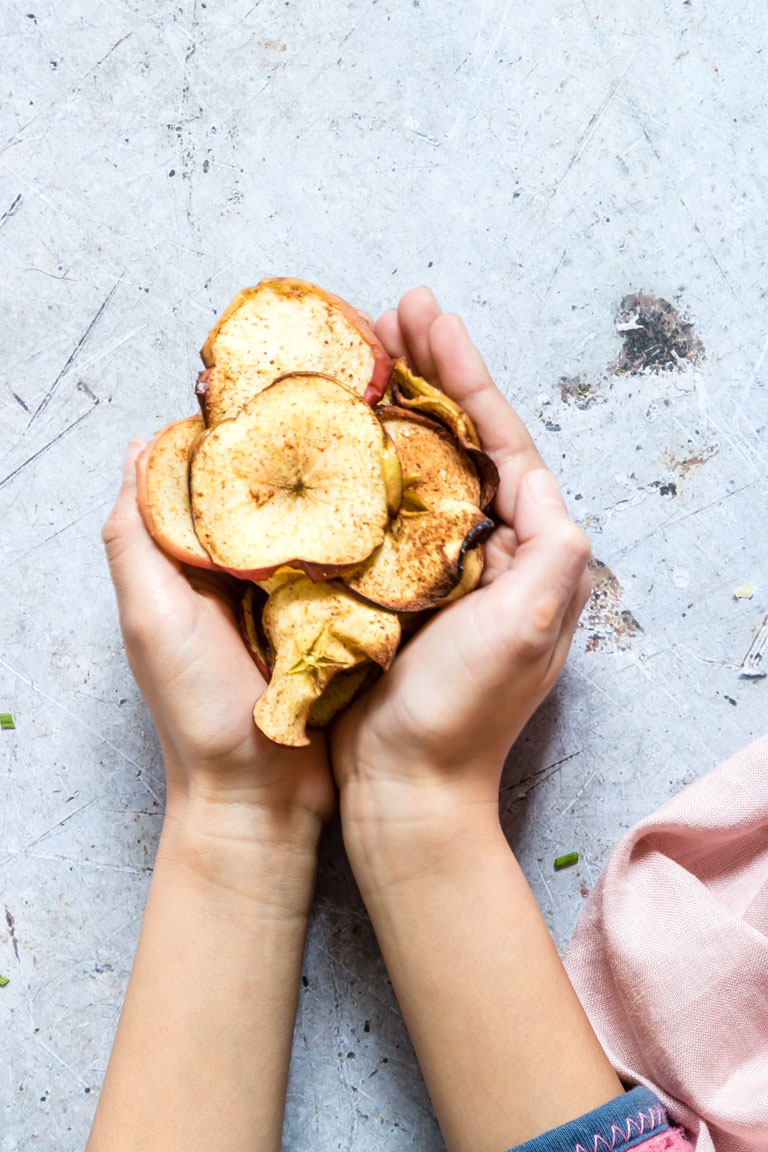a handful of the completed apple chips air fryer recipe