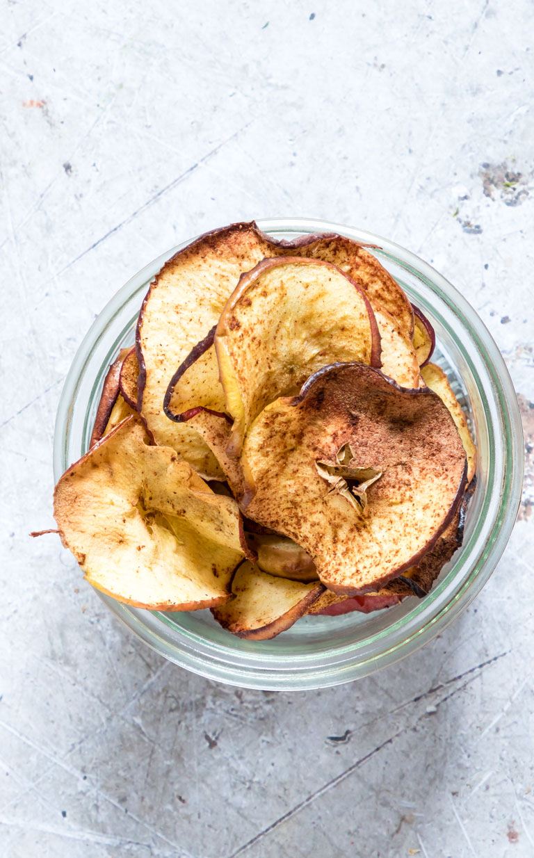 top down view of a jar filled with apple chips air fryer
