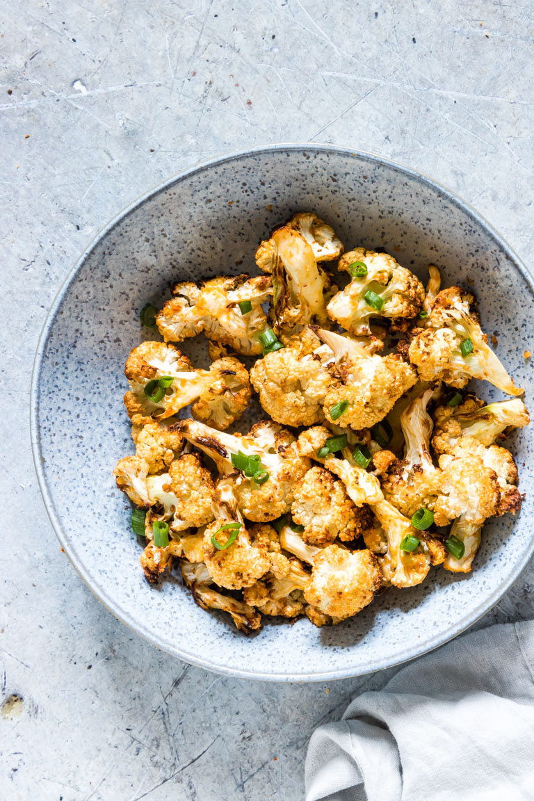 the completed cauliflower wings air fryer recipe served in a blue bowl