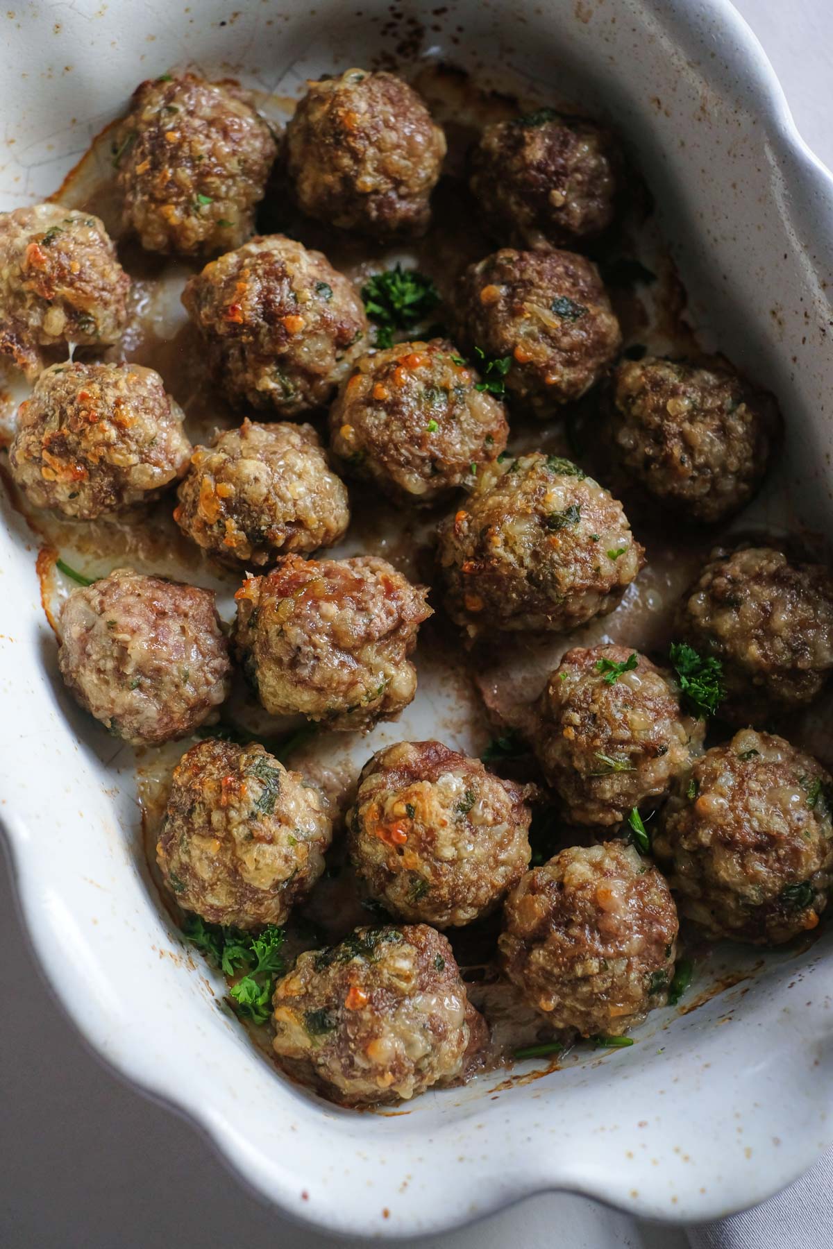 the finished oven baked meatballs in a serving dish