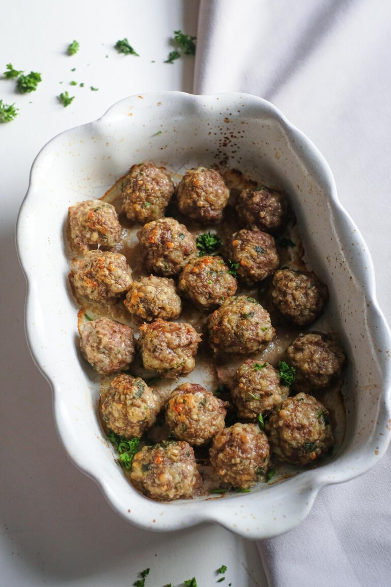 cooked meatballs in a white dish