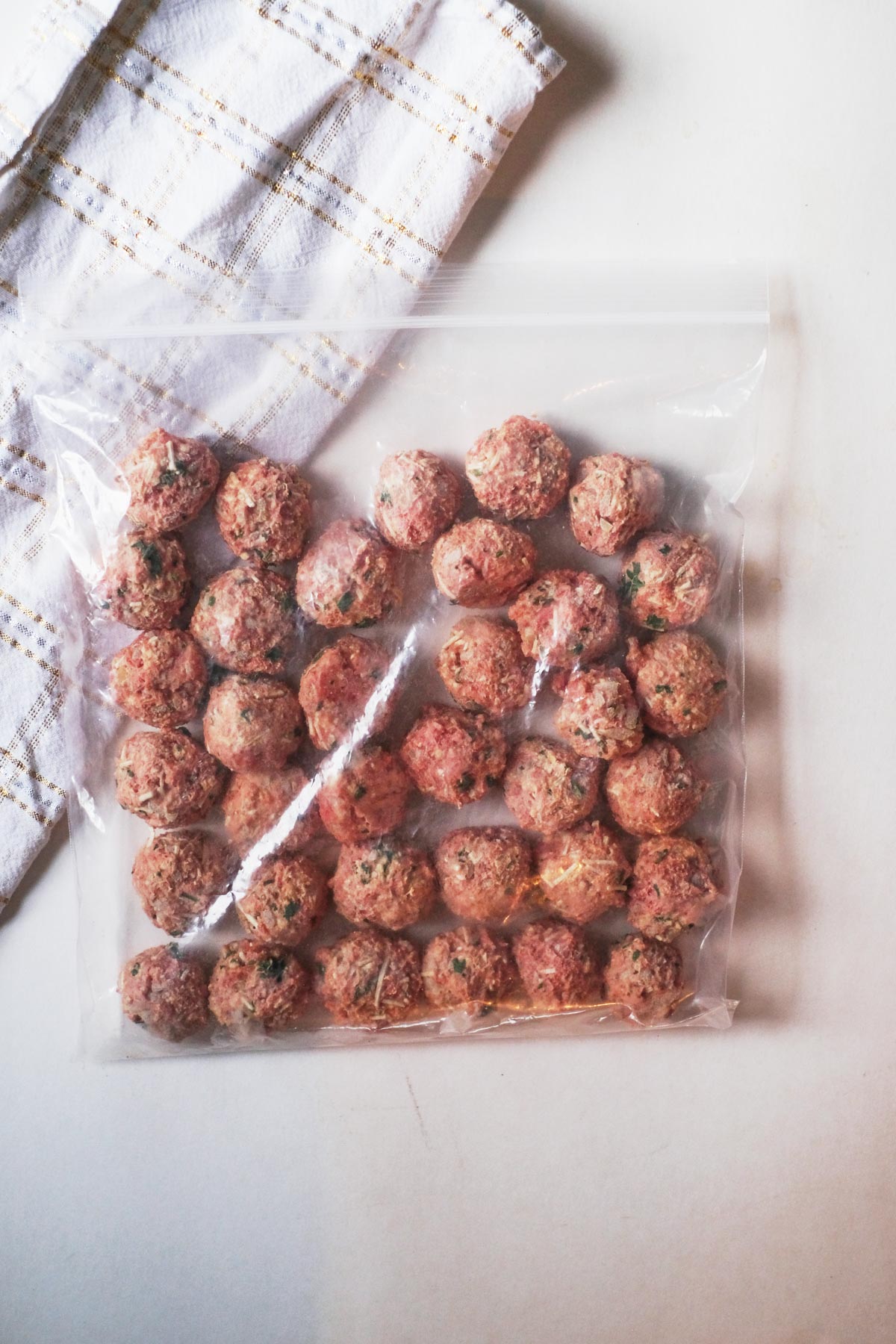 top down view of the frozen meat balls in a plastic storage bag