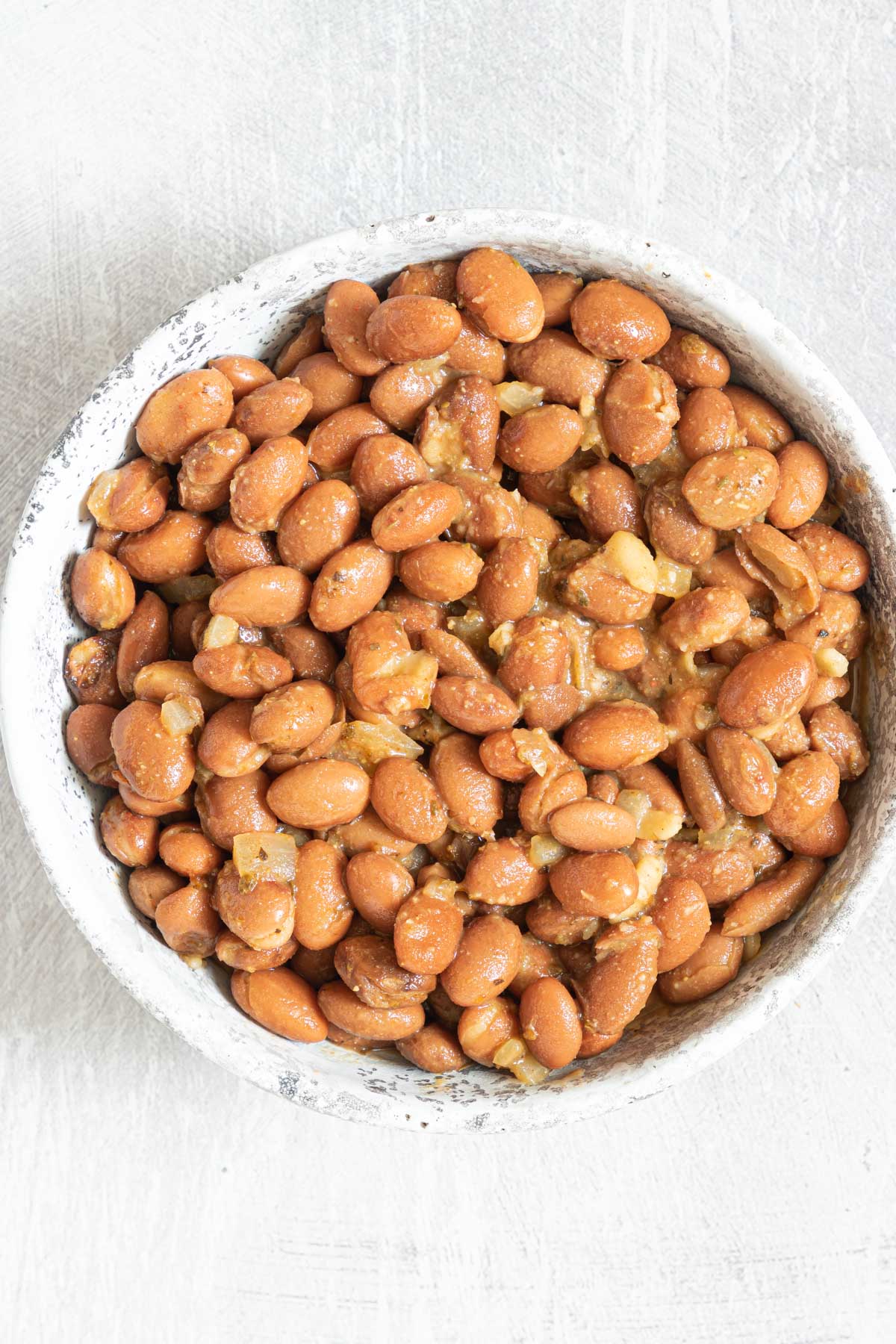 a bowl of season pinto beans