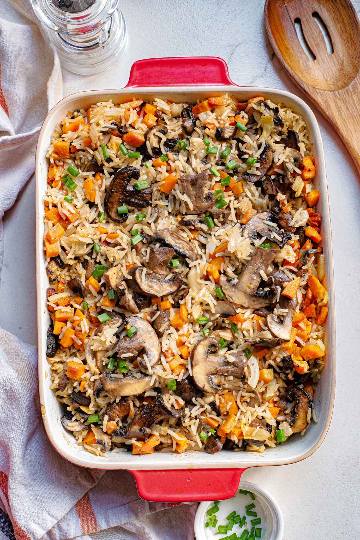 top down view of the mushroom rice in a red baking dish