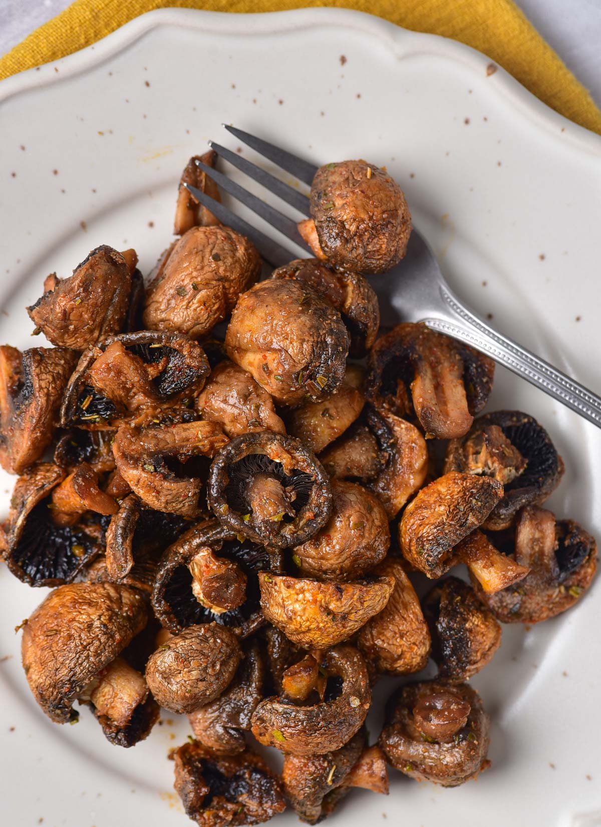 a plate filled with air fryer mushrooms