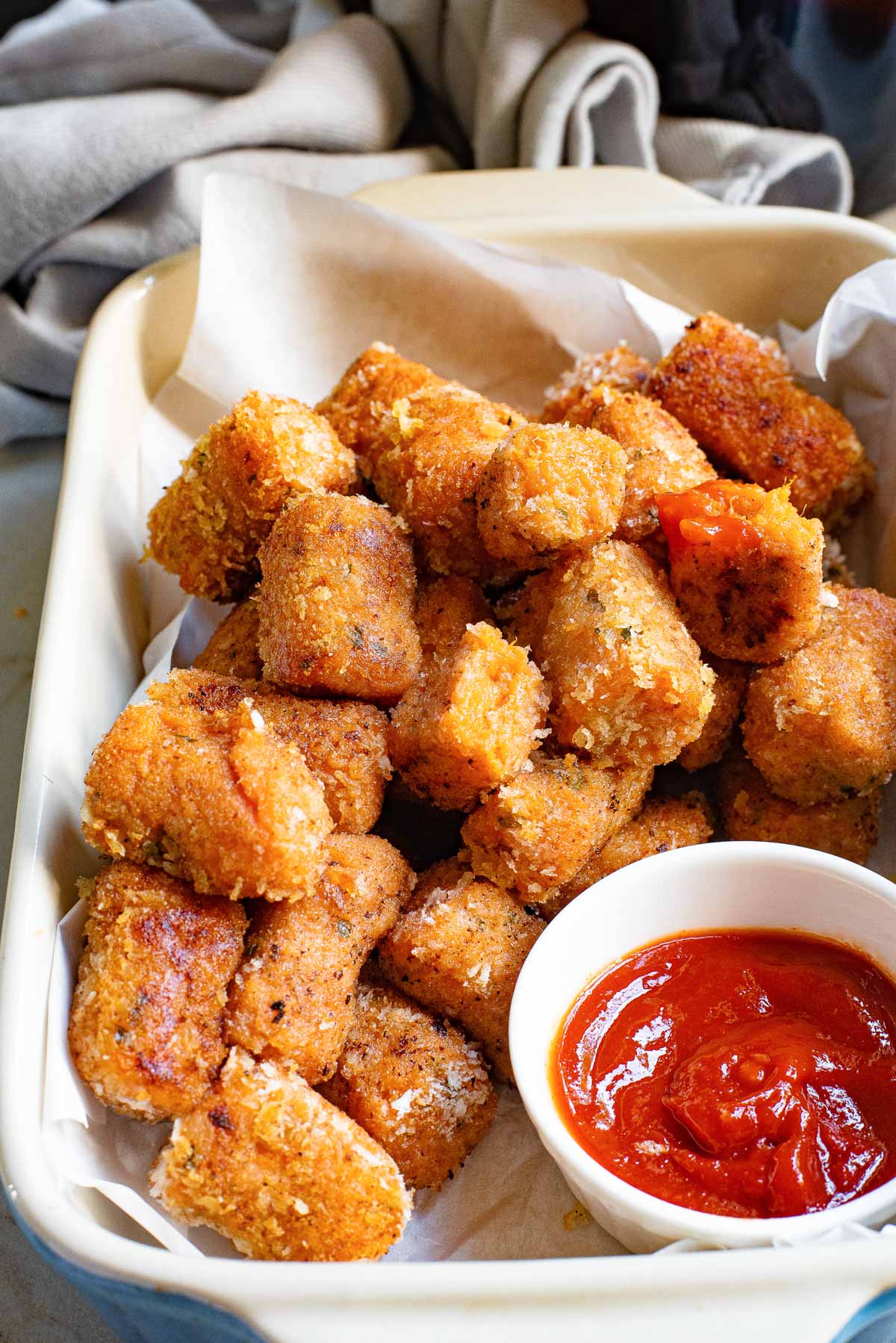 the completed sweet potato tater tots recipe served with dipping sauce