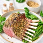the finished air fryer rack of lamb on a serving plate