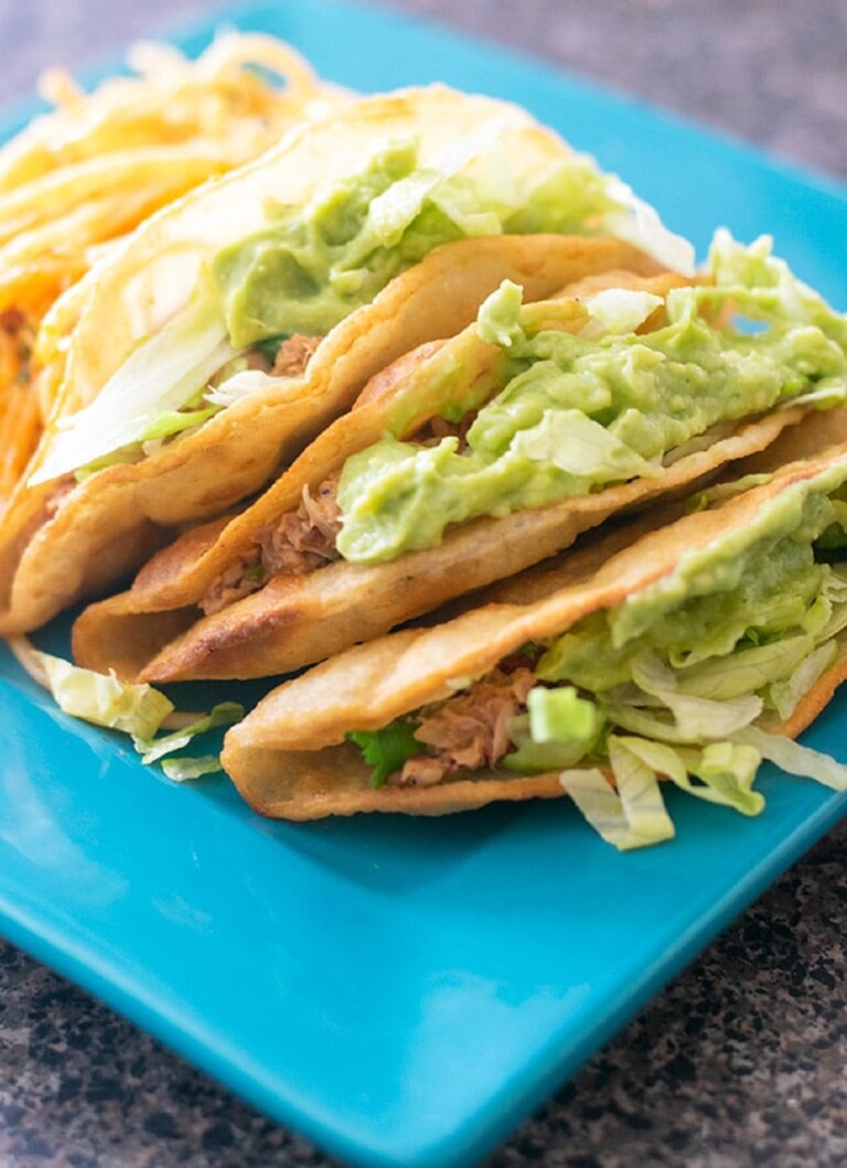 Tacos de Atún (Canned Tuna Tacos) on a blue serving plate.