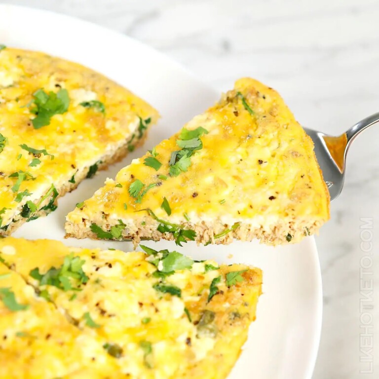 Tuna And Ricotta Frittata, with one slice being served with a lifter.