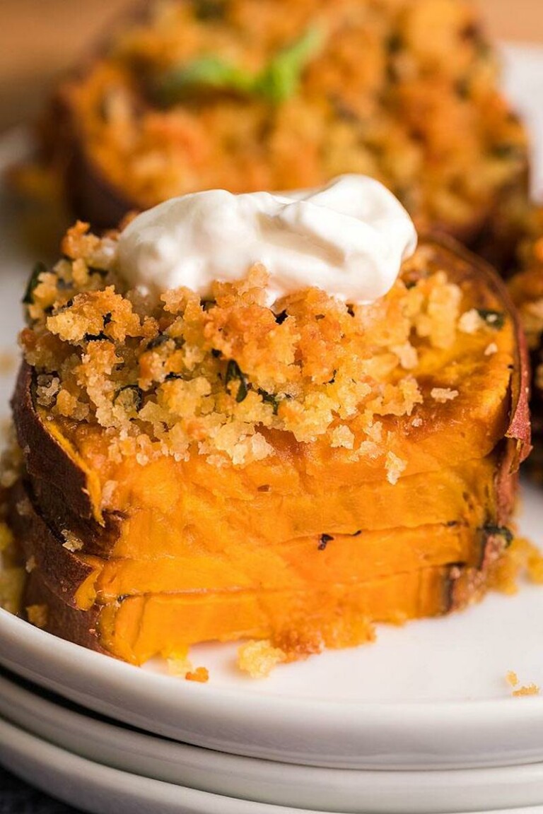 close up view of the finished air fryer sweet potato casserole stacks with a bite removed