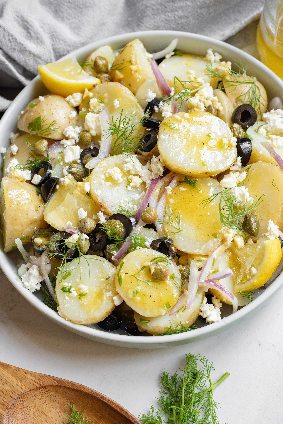 a bowl of greek potato salad ready to be served