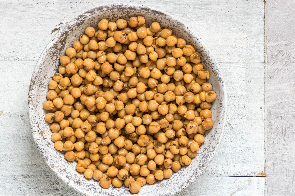 close up view of the how to cook canned chickpeas in a ceramic bowl
