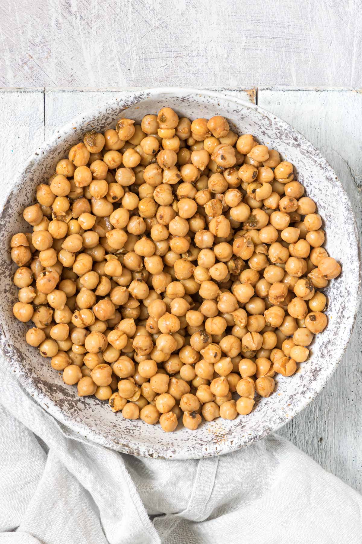 a ceramic bowl containing the finished how to cook canned chickpeas recipe