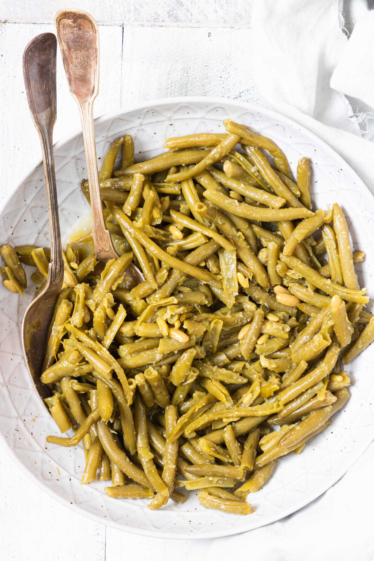 top down view of a serving bowl filled with cooked canned green beans