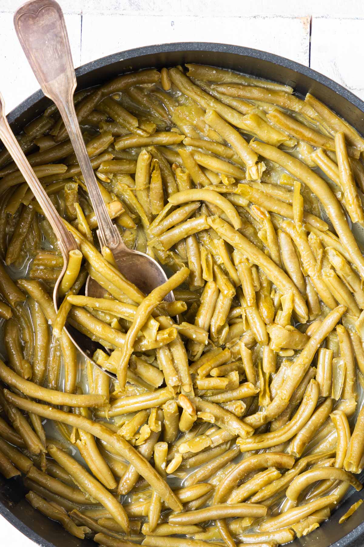close up view of the cooked canned green beans in a skillet