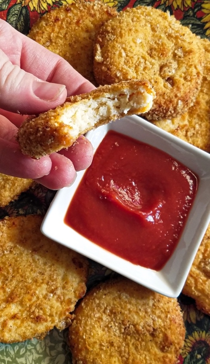 keto chicken nuggets being dipped into sauce