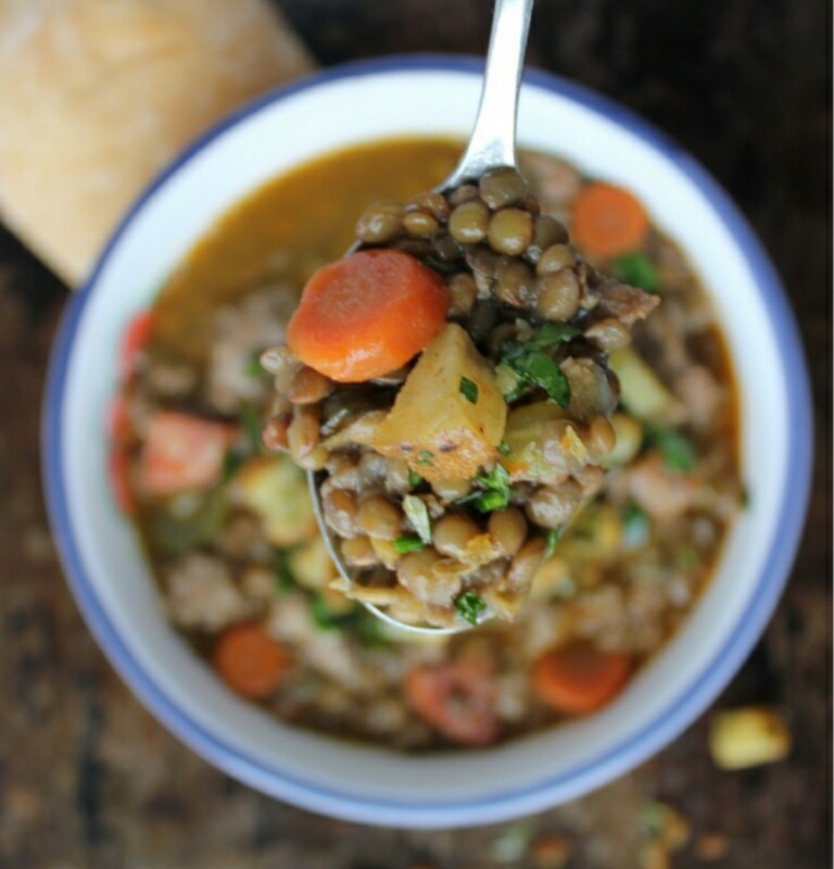 Sausage and Lentil Soup showing a spoon with all the ingredients.