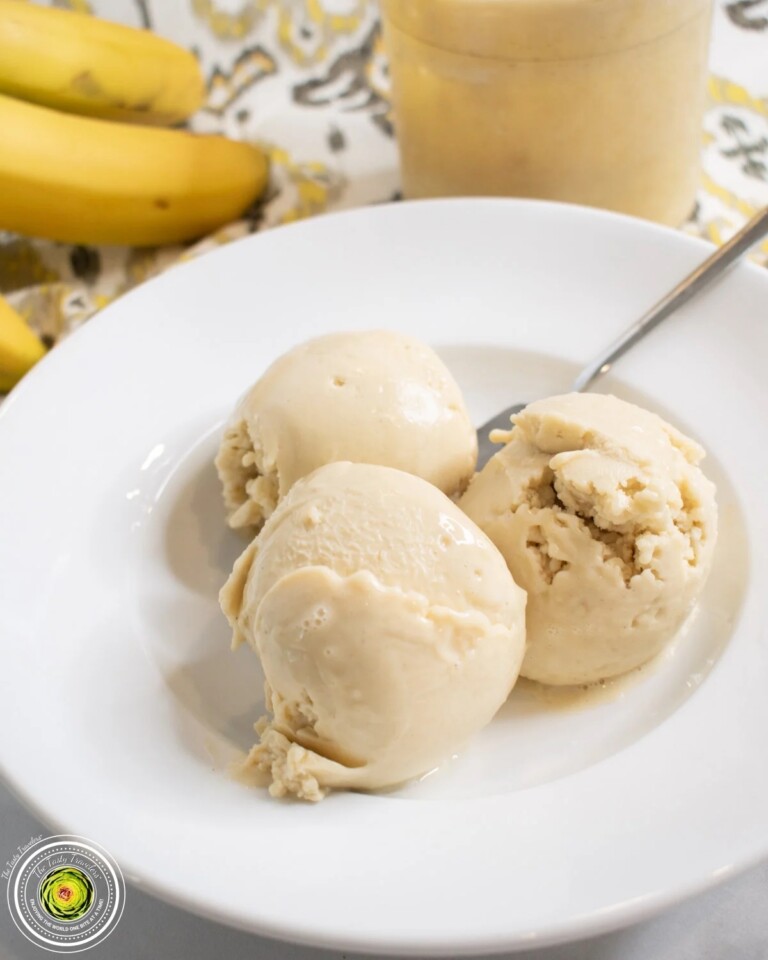 Three scoops of Ninja Creami Banana Cream Pie Protein Ice Cream in a white bowl