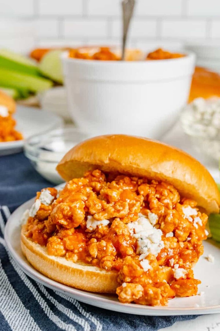 one of the finished buffalo chicken sloppy joes served on a white plate