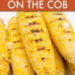 A stack of grilled corn cobs on a plate