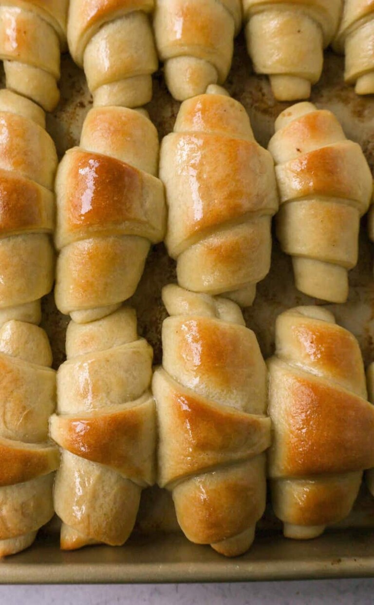 top down view of a baking tray filled with homemade crescent rolls