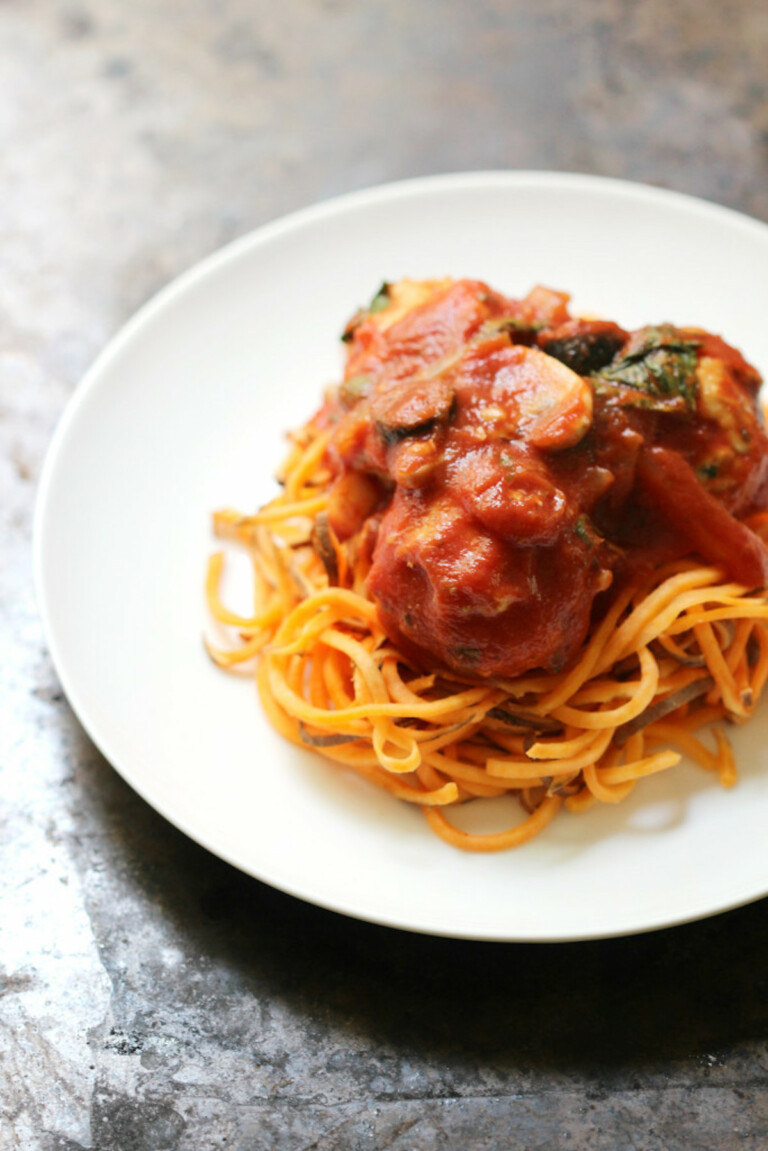 one serving of Italian chicken meatballs and sweet potato spaghetti on a white plate