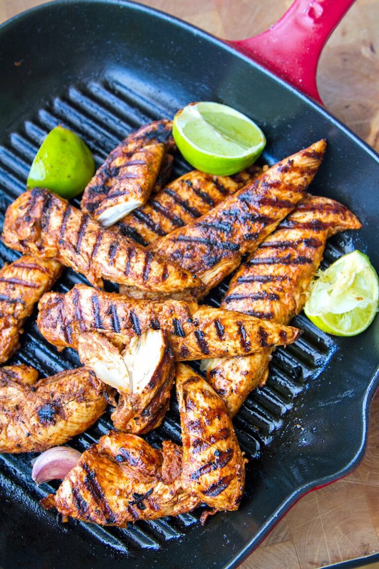 Spicy Paprika and Lime Grilled Chicken Tenderloins in a black grilling pan.