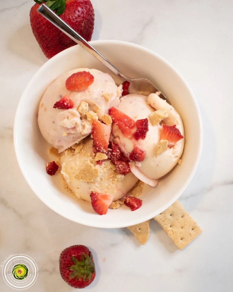 One serving of Ninja Creami strawberry cheesecake protein ice cream garnished with fresh strawberries