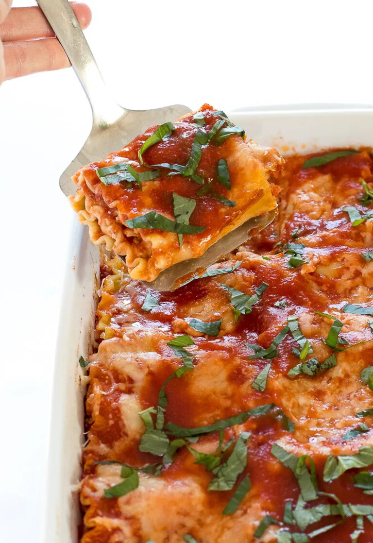 one portion of lasagna roll ups begin removed from the pan