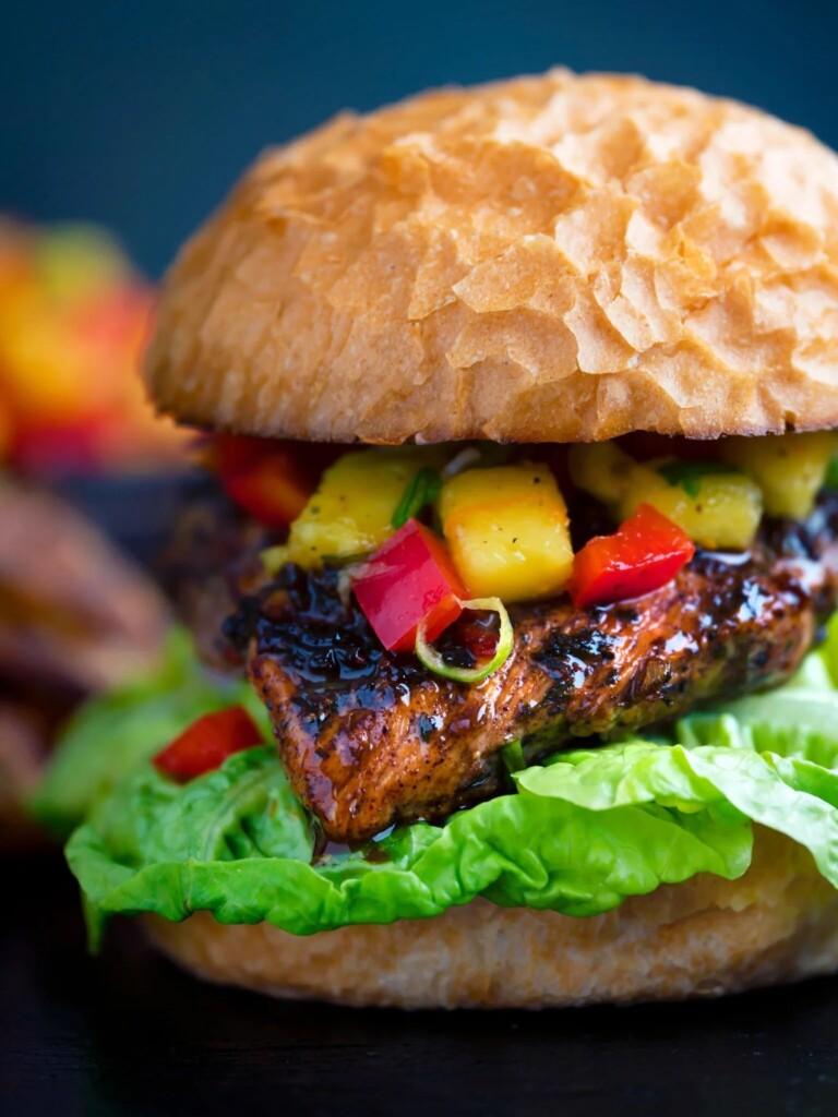 A close up view of the completed jerk chicken burger