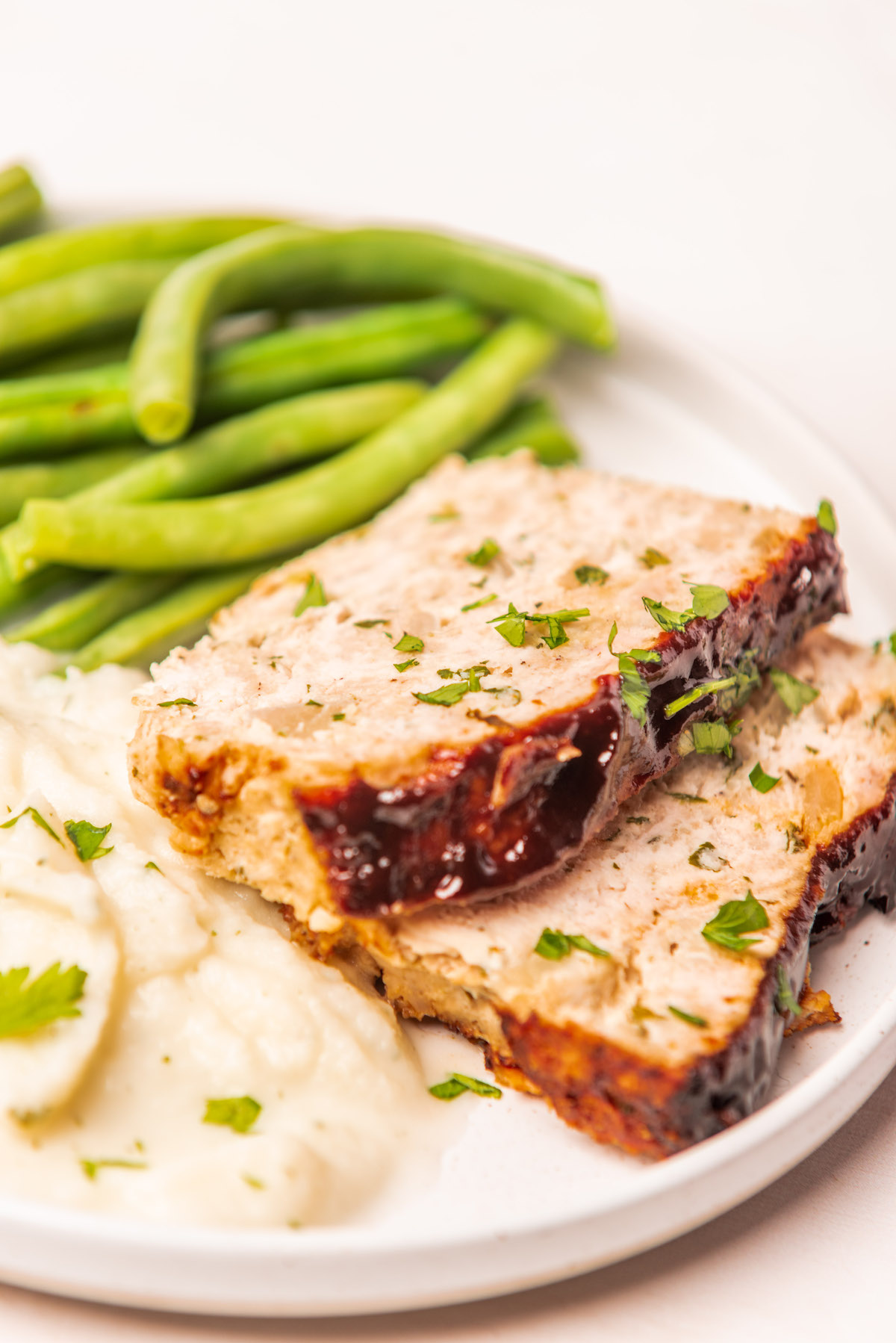 close up view of a serving of chicken meatloaf