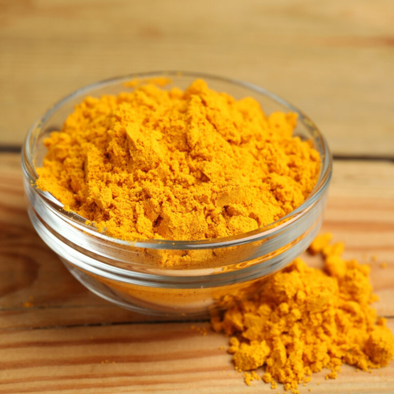 A glass bowl of curry powder